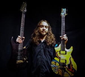 Nick Lee Moon Tooth Guitarist Holding Endorsed Vigier Guitars